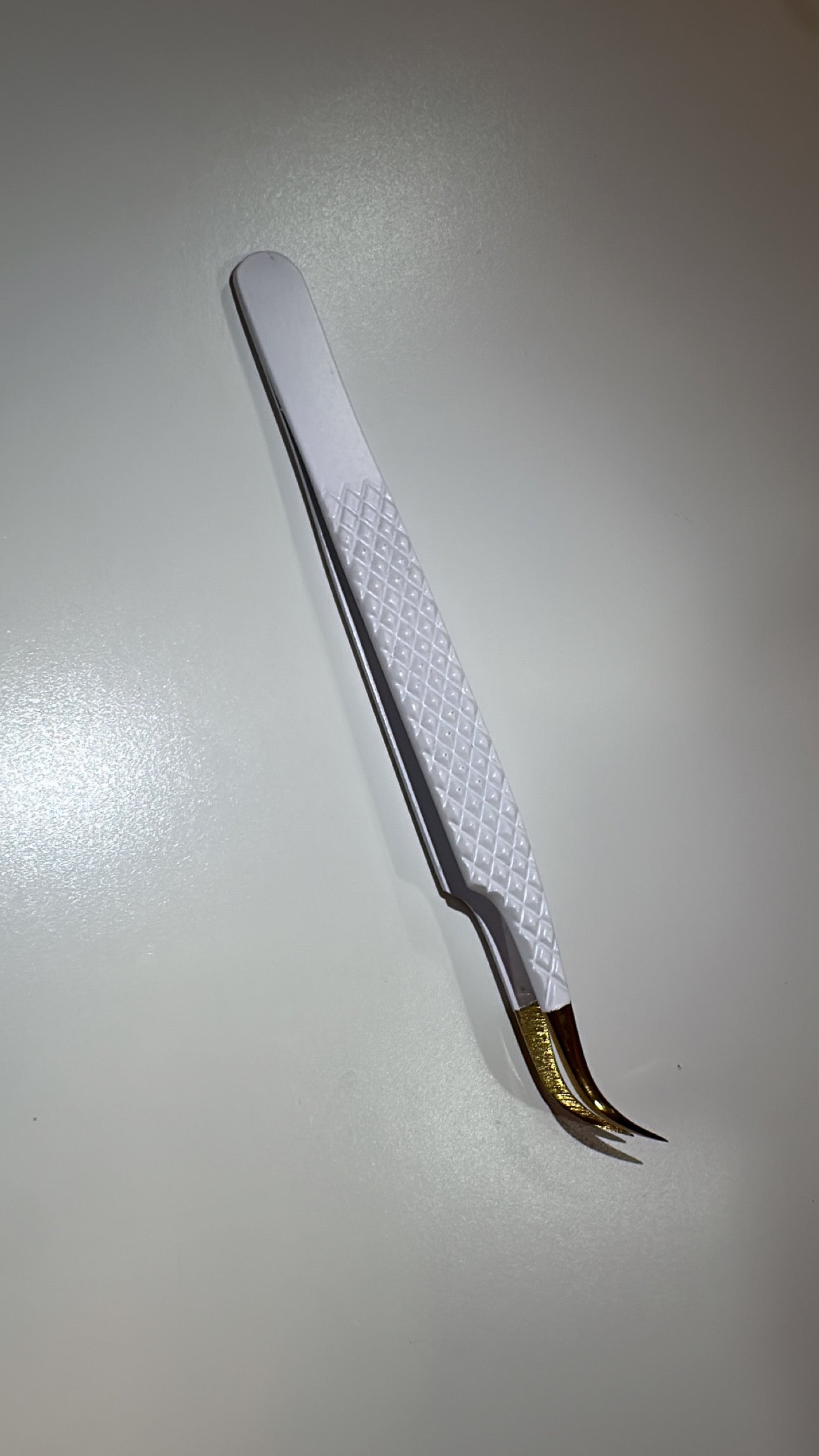 J curved volume tweezer